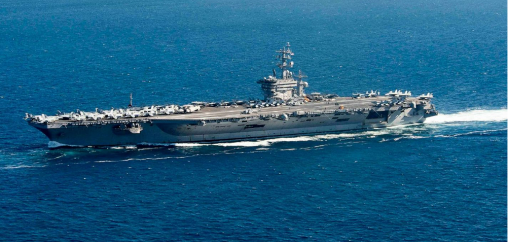 US moves carrier to Middle East following attacks on US forces